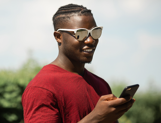 User smiling with phone